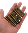 Heavy Duty Iron RV Cabinet Door Hinges Five Pack With Quiet Operation And Vintage Bronze Finish in hand