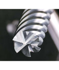 Carbide end mill, 6-flute square cutter, close-up of sharp cutting tip