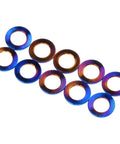Badass Grade 5 Titanium Flat Washers For M5 Metric Bolts With Burnt Blue Finish 10 Pack shown in 3D arrangement.