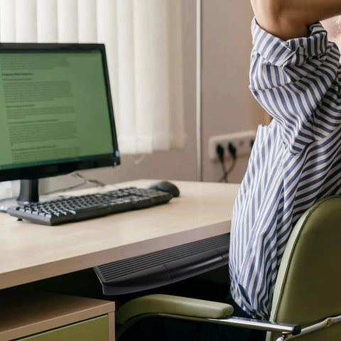 Close-up of Undermount Keyboard Tray With Ergonomic Tilt And Clip Mount attached under a desk with a computer setup.