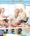 Seniors enjoying Seven Colorful Magnetic Bingo Wands with 200 Magnetic Chips in a group activity setting.