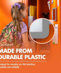 Girl looking at Magnetic Locker Mirror Grab And Go 5 By 7 Inches Portable Gray in locker, durable plastic detail shown.