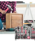 54 Piece Pink Tool Kit For Women Newbies DIY Home Repair Tools Set In Portable Toolbox Case in use by woman assembling a crate