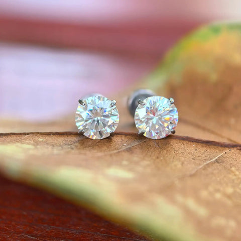Premium D Color Moissanite Stud Earrings Crafted From Certified G23 Implant Grade Titanium Screw Back For Tragus Cartilage Labret Helix Piercings Nickel Free Hypoallergenic good vibes for sensitive skin slay game strong for women men 3MM size on brown leaf.