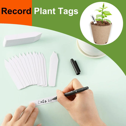 Person writing on plant tag for 132 Pack 4 Inch Pulp Plant Pots With Drainage Holes Seedling Nursery Box Seed Starting Tray And 132 Plant Labels Organic Peat Pots For Germination Bulk Garden No Fuss Starter Kit For Indoor Or Outdoor Seeds
