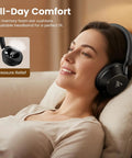 Woman relaxing wearing over ear studio monitor headphones for recording and mixing, closed back, 50mm drivers, dual jacks.