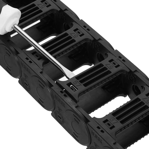 Close-up of open type drag chain cable carrier with end connectors, 25x57mm inner size, black plastic, for CNC router machines.