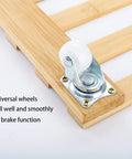 Close-up of wheel on Three Pack Bamboo Plant Caddies with Rolling Wheels, 12 Inch Square Plant Stands on Universal 360 Degree Rotating Dollies.