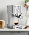 Slim Espresso Machine With Milk Frother, 20 Bar Italian Pump, Fast Heat 1350W, Barista Grade Crema Espresso At Home, Stainless Steel Silver on kitchen counter with coffee cup.