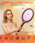 Woman using Three In One Rechargeable Electric Fly Swatter With 4200V Bug Zapper, 360 Degree Rotating Head indoors