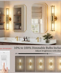 Klighten Hardwired Wall Sconce Modern Brushed Brass Bathroom Vanity Light installed above a double vanity with dimmable feature.