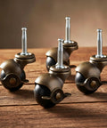 Heavy Duty 1.5 Inch Ball Casters With Secure Lock Brake Furniture Movers Set Of 4 Smooth Polyurethane Rollers on a wooden surface.