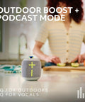 Wonderboom 4 Portable Bluetooth Speaker with Waterproof Floating Design on kitchen counter, woman preparing food in background.