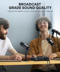 Two people using XLR Dynamic Podcast Microphone With Cardioid Pickup, Built In Double Layer Pop Filter in a recording session