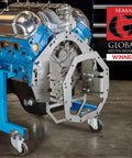 Tremec T-56 Adjustable Mock Up Bellhousing Transmission Fitment Jig With Universal Muscle Car Swap Adapter aligned with blue engine block.