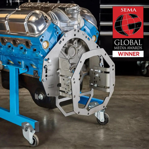 Tremec T-56 Adjustable Mock Up Bellhousing Transmission Fitment Jig With Universal Muscle Car Swap Adapter aligned with blue engine block.