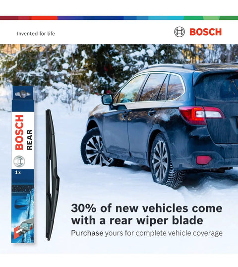Car in snowy landscape showcasing Bosch rear wiper blade for efficient snow and ice removal with packaging displayed.