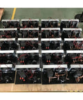 Multiple portable micro air conditioners with plates and compressors in a factory setup for 200W performance and 24V DC support.