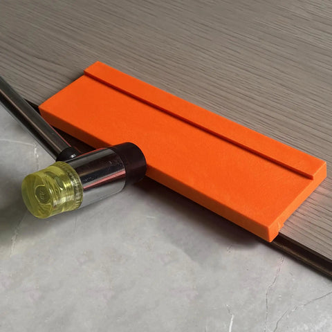 Pro Grade Three Edge Tapping Block For Vinyl Flooring And Laminate Installations with hammer, showing 3.5mm bevel edge use.