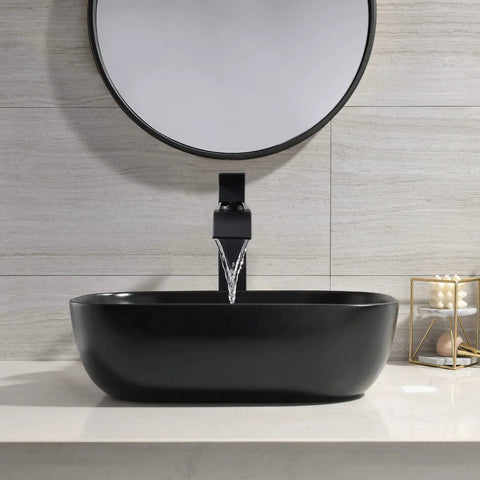 Black Rectangle Vessel Sink 18x13 Above Counter Porcelain Ceramic With Faucet And Drain Combo in modern bathroom setting.
