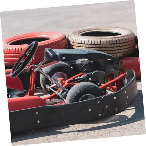 Universal 14 Inch PU Racing Steering Wheel With Horn Button Red Drift Style on gokart with tire barriers in background
