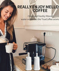 Water Filter Replacement Pack For Breville Espresso Machines Claro Swiss Oracle Barista Touch And Bambino Series Four Pack Compatible With BES008WHT0NUC1 on kitchen counter near woman making coffee in espresso machine.