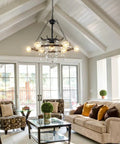 Living room with Wagon Wheel Chandelier 9 Light Black Farmhouse Industrial Metal Pendant Light With Crystal Accents