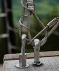 M5 x 25mm 304 Stainless Steel Eye Bolt for rigging and lifting, installed in wooden surface with cables attached, side view