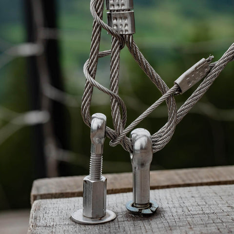 M5 x 25mm 304 Stainless Steel Eye Bolt for rigging and lifting, installed in wooden surface with cables attached, side view