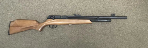 Side view of Hard Hitting 25 Cal PCP Air Rifle with 3500 PSI Tank for serious power and precision on a beige background.