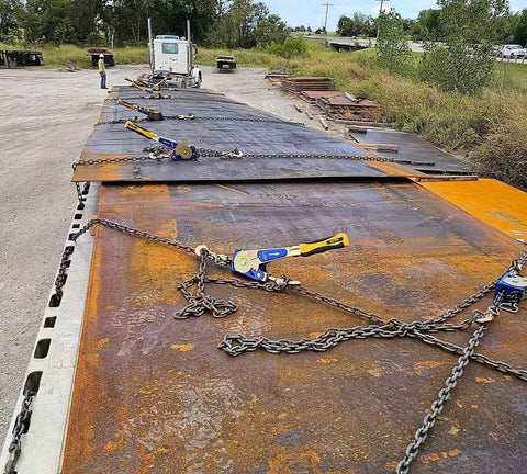 Two Pack Heavy Duty Ratchet Chain Binders 5/16 to 3/8 Inch With Swivel Grab Hooks And 5400 Lb Working Load Limit securing metal sheets on flatbed trailer