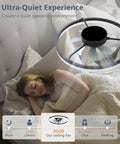 20 Inch Black Bladeless Ceiling Fan Drops Slick Integrated Looks With A Clean Seamless Silhouette Plus Bright Led Lighting Effortless App Control And A Tight Flush Mount Fit Perfect For Compact Rooms Where You Want Fresh Air That Feels Crisp above a sleeping woman in a cozy bed.