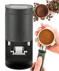 Dope 58mm Electric Coffee Tamper That Makes Espresso Tamping A Breeze With Switchable Five To Thirty Kilogram Grip And Quick One To Three Tap Modes For Everyday Brews And Clean Extraction In Matte Black Housing with coffee grounds.
