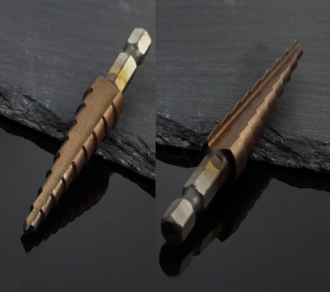 Cobalt Step Drill Bit Set With 1/4 Inch Hex Shank on black slate, showing M35 HSS Co alloy with double straight flute design