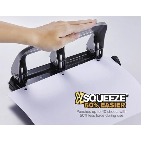 Hand using EZ Squeeze Three Hole Punch With No Jam Technology Pushing Through 40 Sheets Effortlessly For Home Office Use