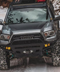 ATV with Heavy Duty 4500 Lb Electric Winch For ATV UTV Jeep With 12V Motor Synthetic Rope IP67 Waterproof in snowy terrain