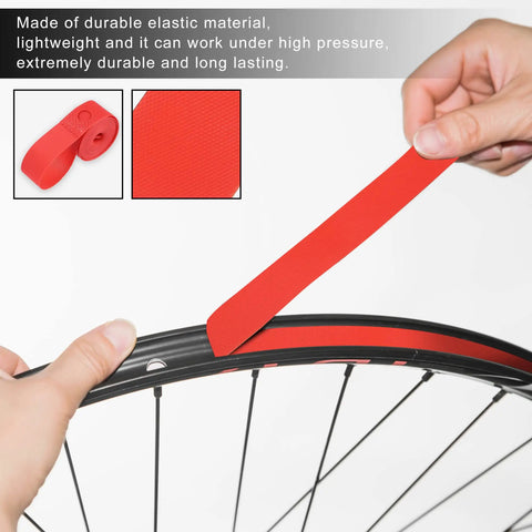 Hands applying red PVC rim tape for 700C 27 inch bike wheels, rim liner strip to protect inner tube and prevent flats.