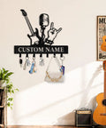 Personalized Guitar Key Holder For Wall With Custom Name, metal mount with guitar silhouette and hooks in a music-themed room