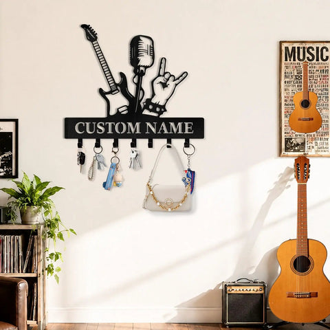 Personalized Guitar Key Holder For Wall With Custom Name, metal mount with guitar silhouette and hooks in a music-themed room