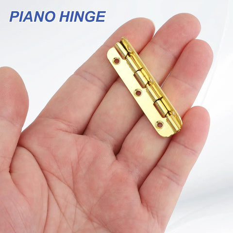 Gold tone steel Badass Tough 90 Degree Small Piano Hinges For Jewelry Boxes And Woodworking Crafts held in hand.