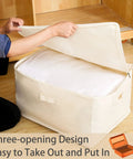 Person opening Heavy Duty Cotton Storage Bags With Clear Window And Sturdy Zipper 75L Collapsible Closet Organizer