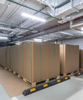 Large cartons secured with 25 Pack Galvanized Steel Cord Strapping Buckles 32mm Wide For Packaging And Shipping on pallets in a warehouse.