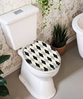 Round Black white checkered Toilet Seat on a white toilet, featuring a diamond pattern, in a stylish bathroom setting.