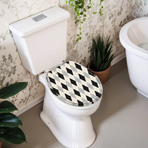 Round Black white checkered Toilet Seat on a white toilet, featuring a diamond pattern, in a stylish bathroom setting.