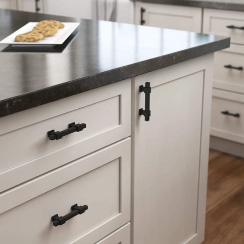 5 Pack Matte Black Cabinet Handles And Adjustable Drawer Pulls For Kitchen Cabinets Dressers And Cupboards Fits 1-3/8 To 4 Inch Hole Centers 35-102 mm Adjusta-Pull shown installed on white cabinets in a kitchen.