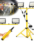 Two-Head LED Work Light With Adjustable Foldable Tripod Stand, 21000 Lumen Portable Flood Light For Outdoor Job Sites, Garage, Workshop And Construction, IP66 Waterproof; image shows LED work light on tripod with detachable heads in use at a construction site