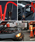 Heavy Duty 1 Gauge Car Battery Jumper Cables 25 Ft 900 Amp Auto Jump Starter Lead connected to a car battery.