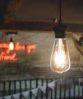 Vintage Edison Style LED Filament Bulb 40W Equivalent E26 Non Dimmable 450 Lumens Warm White 2700K glowing in room