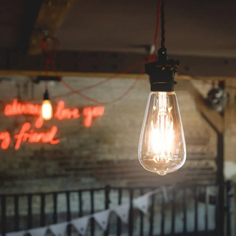 Vintage Edison Style LED Filament Bulb 40W Equivalent E26 Non Dimmable 450 Lumens Warm White 2700K glowing in room