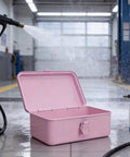 Badass Pink Metal Toolbox With Reliable Locking Latch Built Tough For Your Sweet Ride And Garage Grinds To Keep Every Wrench And Drill Perfectly Locked And Ready, open with water spray in garage.